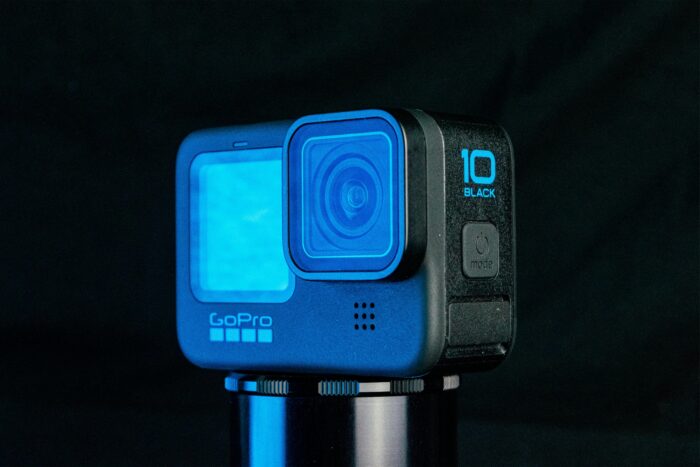 A modern GoPro camera with blue accents against a dark background, showcased for its sleek, high-tech design.